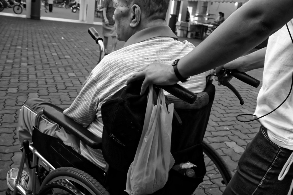 A senior sitting on wheelchair