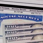 Social Security Card, benefits statement and 100 dollar bills. Social security funding, payment, retirement and federal government benefits concept