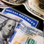 bunch of money and the social security card in the middle