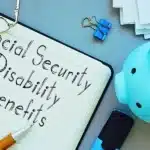 Social Security Disability Benefits are shown on the conceptual business photo. disability overpayment